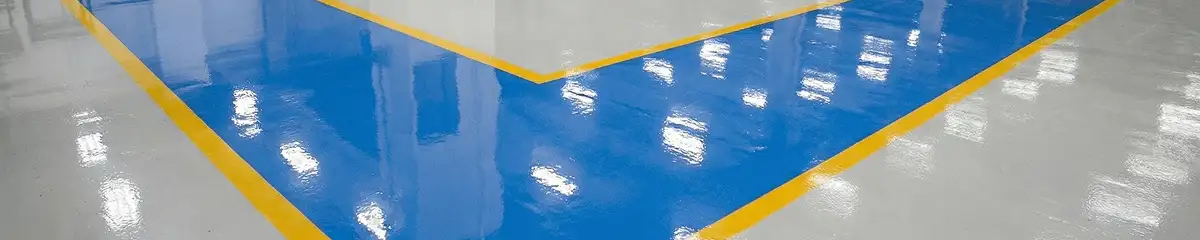 A factory floor professionally covered and marked with epoxy flooring in Rochester, NY