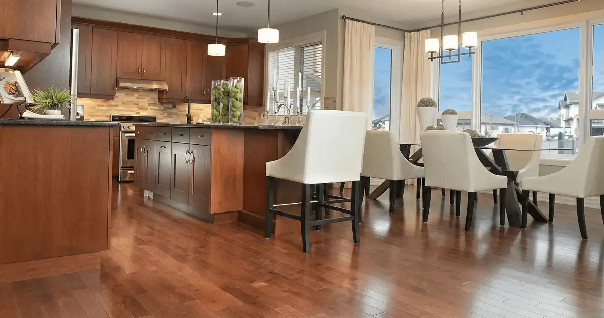 A modern kitchen with professionally installed wood flooring in Rochester, NY