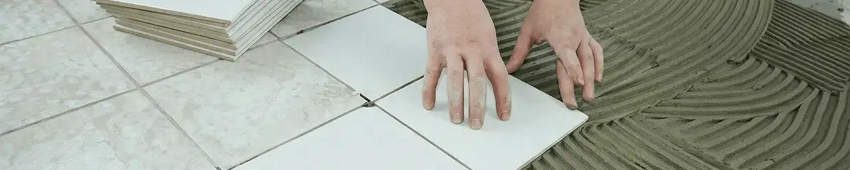 Professional installing white tile floors in Rochester, NY