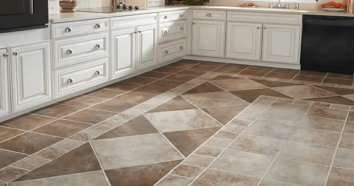 Kitchen with white cabinets and a professionally installed tile floor in Rochester, NY
