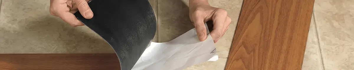 A professional installing vinyl flooring in Rochester, NY
